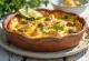 Torta Capixaba with cilantro, golden brown top, filled with seafood