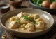 Cold Satsivi chicken in walnut sauce garnished with cilantro
